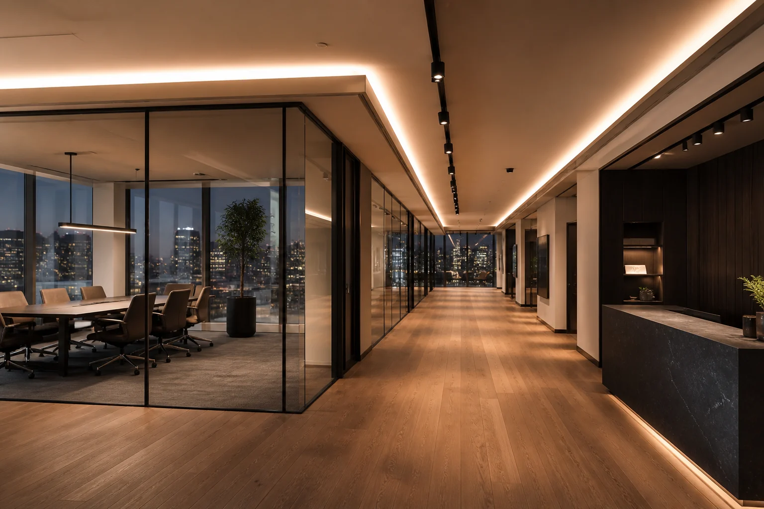 Contemporary office with warm linear lighting and glass meeting rooms
